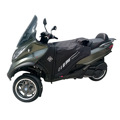 TABLIER COUVRE JAMBE TUCANO POUR PIAGGIO 125 MP3 2006+, 250 MP3 2008+, 300 MP3 2012+2018, 400 MP3 2008+2021, 500 MP3 2010+2021 (R062PRO-X) (TERMOSCUD PRO 4 SEASON)  (SYSTEME ANTI-FLOTTEMENT SGAS)